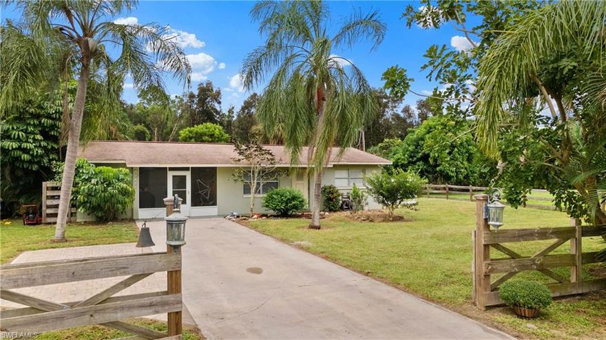 Nature Lover's Oasis! Welcome home to this peaceful & private property located in the heart of Bonita Springs. This 2 bedroom, 1 bathroom single family home has been perfectly placed on .58 acres of lush landscaping, wildlife, and water views. The private backyard overlooks a pond and offers endless outdoor entertaining options: enclosed patio and a tiled bonus area. Inside the home, you will find tile floors & fresh paint throughout, 2 bedrooms, 1 bathroom, and a spacious living room. The bathroom has been completely renovated with tasteful finishes and a walk-in shower. Additional upgrades include a new AC in 2019 and new water heater in 2020. There is no shortage of extra storage in this home as it is equipped with a screened-in carport, workshop, and indoor laundry room. Take advantage of this rare opportunity to own an oversized lot close to the best beaches, shopping, and entertaining in Bonita Springs- call today!