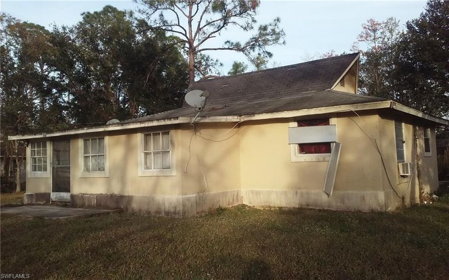 STARTER SINGLE FAMILY HOME PID: 61733800008 and 61733880604 ON 2 HALF ACRE LOTS = FOR A TOTAL OF 1 ACRE - ONE OF THE LOWEST PRICE IN ALL OF NAPLES. SOLD AS IS. OUR DAMAGE FROM IRMA MAKES YOUR GAIN IN PRICE DISCOUNT. CASH ONLY.  CLOSE IN AREA. WALK TO GOLF COURSE. NO SHOWINGS FRIDAYS AFTER 5 P.M. AND SATURDAYS AS PER OWNERS.