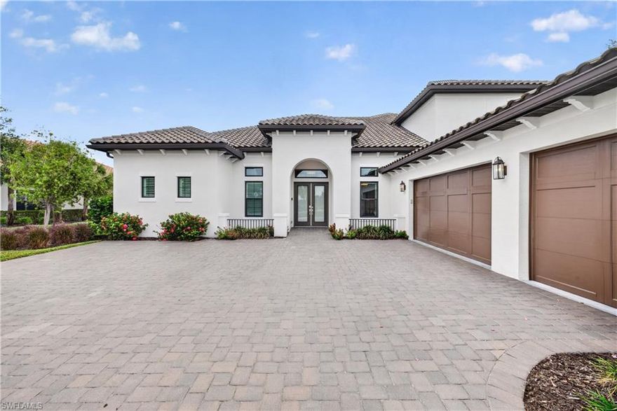 Welcome to 8709 Cavano Street, an exceptional residence located in the highly sought-after gated community of Esplanade Golf & Country Club in Naples. Full Golf Membership. Newest home in the community. Built in 2022. New Beacon Model. Loaded with upgrades. Some of which include an indoor fireplace and an outdoor fireplace. Outdoor kitchen with pool and spa and highly upgraded pavers. Perfectly blending luxury, comfort, and the ultimate Southwest Florida lifestyle, this beautifully appointed home offers refined indoor-outdoor living in one of Naples’ premier resort-style communities.

This home is being offered Turnkey Furnished which was completed with high end furniture both inside and out! Step inside to discover an open and airy floor plan filled with natural light, elegant finishes, and sophisticated design details throughout. The spacious living areas flow seamlessly into a gourmet kitchen featuring premium cabinetry, quartz countertops, stainless steel appliances, a large center island, and generous entertaining space ideal for hosting family and friends.

The luxurious primary suite serves as a private retreat with spa-inspired bath accommodations, dual vanities, an oversized walk-in shower, and expansive closet space. Additional guest bedrooms and flexible living areas provide comfort and privacy for visitors while allowing room for a den, office, or media space.

Outdoor living is truly exceptional, with a screened lanai designed to embrace the Florida lifestyle. Enjoy peaceful water and lush tropical views while relaxing by the pool and spa, dining al fresco, or entertaining in the spacious covered outdoor living area.

Residents of Esplanade Golf & Country Club enjoy world-class amenities including an 18-hole championship golf course, resort-style pool, tennis, pickleball, fitness center, walking trails, spa services, fine dining, Bahama Bar, and an active social lifestyle.

Ideally located just minutes from Naples’ renowned beaches, shopping, dining, and entertainment, 8709 Cavano Street offers the perfect opportunity to experience luxury resort living at its finest.