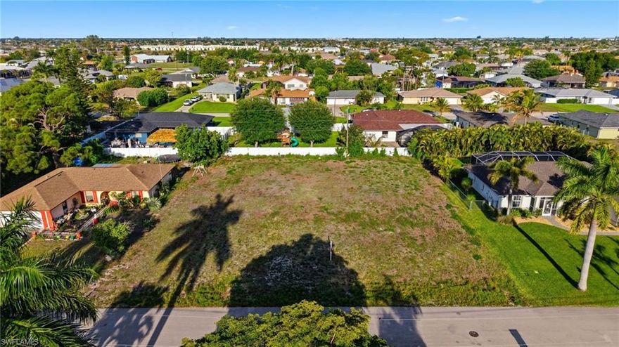 Oversized TRIPLE LOT in one of the Cape Coral's most desirable locations. Ideal for both homeowners and savvy investors. City water and sewer assessments are fully paid, adding immediate value. Design and build your dream home with plenty of room for a custom pool and spa, all under a spacious screened lanai. Envision an outdoor kitchen, lush landscaping & fencing, creating your own private oasis in the Florida sunshine. Western rear exposure delivers breathtaking sunset views night after night. Cape Coral is known for its expansive canal system, year-round boating lifestyle and access to some of Southwest Florida’s most beautiful waterways, beaches and islands. Launch from nearby public ramps, join a boat club or spend the day on the water with ease. Conveniently located just minutes from waterfront dining, boutique shopping, golf courses, schools and everyday essentials. Close proximity to Tarpon Point, Cape Harbour and Downtown Cape Coral puts the best of the area right at your fingertips. Enjoy nearby parks, fishing spots, scenic biking and walking trails throughout the community.