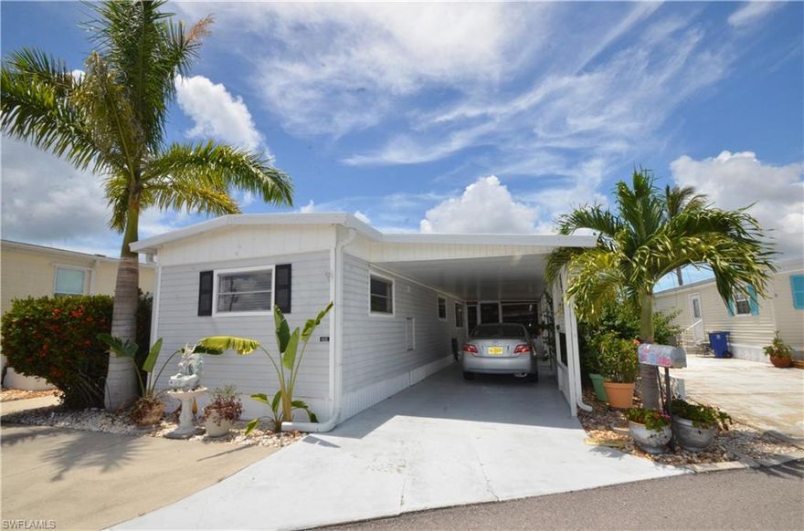 This partially furnished 2/1 mobile has extra living area with the Florida Room and the Sunroom!  The large carport may hold 2 cars, and there is additional concrete parking on the east side of the home, and out front.  The refrigerator is brand new.  The plumbing in the kitchen and bath have been redone.  The polywood blinds are custom made.  The washer is only a year old.  Are you looking for additional storage?  There is a shed with the laundry, laundry tub, and workshop!  Plus, there is an additional storage area for your holiday items!  There is no lawn to care for saving you time for more fishing and relaxing.  This is one of the best priced waterfront homes in St. James City!  Make your appointment before it's too late!
