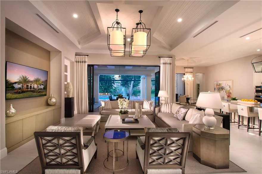 From the moment you walk into a Stock Custom Home, you will see and feel the difference. Elegantly furnished 4,323-square foot under air home on an oversized lot. Open floor plan boasts Grand Foyer with coffer ceilings, cove molding and lighting. Great room, kitchen with expanded island, elegant dining room. Four en suite bedrooms, 4.5 baths. Key Indoor Features: Custom ceilings and trim including tongue & groove details and crown molding. Study with built-in wall cabinetry and adjacent wet bar. Designer lighting and accent light package, outlets installed in base board, linear diffusers in all main living areas, master suite and study. Wood, stone and tile floors. Smooth drywall ceilings and walls. Reverse Osmosis System.Outdoor features include covered lanai with motorized storm shutters. Oversized salt generating pool and raised spa, gas raised fire feature, sun shelf pool cage with panoramic view. Enjoy an open fire with Tremon 40" fire pit and paver sitting area overlooking the private pond equipped with LED lighting, water fountain and power package. Full outdoor kitchen with grill, bar, and Naturekast cabinetry. Circular driveway with three-car garage and golf cart storage.