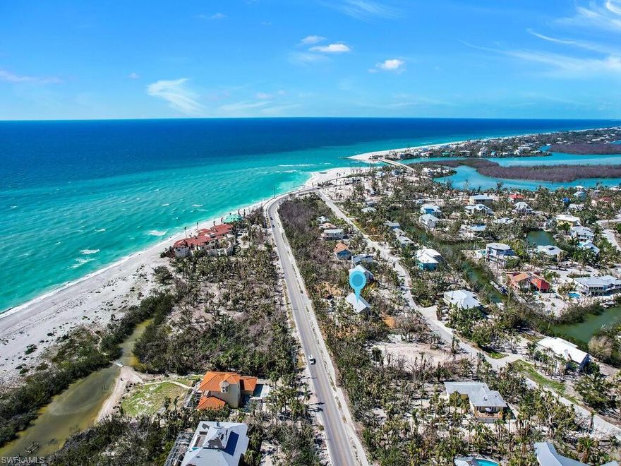 Welcome to your dream coastal retreat on Sanibel Island! This stunning turnkey home boasts a two-bed, two-bath layout with a coastal casual design throughout. The open concept living space features luxury vinyl flooring, high ceilings, and plenty of natural light. Step out of the living room to your private screened lanai and enjoy tropical views with your morning coffee or to enjoy sunset.  The primary suite offers en-suite bathroom and a private back patio. The secondary bedroom and bath are perfectly designed for family or guests.  The home has no hurricane damage and is full of new updates.  Including new exterior and interior paint, luxury vinyl flooring, hurricane impact windows and doors, new AC and ductwork, and a fully redone downstairs open space with all new electric work and speckled, epoxied, and sealed floors to be your perfect outdoor entertaining space. You are minutes away from Blind Pass beach, top-rated restaurants, shopping, and all that Sanibel and Captiva have to offer. Don't miss out on owning your piece of paradise!
