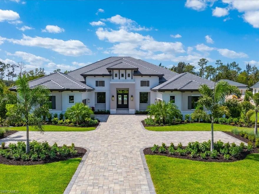 A striking expression of contemporary coastal design, 6462 Daniels Road is a newly completed estate by Stock Custom Homes, artfully designed by Coco Interiors and set across two and a half acres of coveted southern exposure in Livingston Woods. Encompassing four thousand four hundred forty-one square feet under air, this four-bedroom plus office residence offers a rare balance of architectural intention and effortless livability. From the moment you enter, the home reveals a layered, design-forward aesthetic that feels both grounded and refined. Earthy wood tones harmonize with polished chrome, light bronze, and deep iron finishes, creating a rich material palette that evolves throughout the interiors. Custom wall and ceiling details reinterpret classic coastal influences through a modern lens, while a soothing composition of soft tans, warm browns, and crisp whites is elevated by cool blues, muted greys, and striking hints of black for depth and contrast. Carefully curated, nature-inspired accessories and bold abstract artwork further enhance the home’s sophisticated character. The main living areas flow seamlessly into expansive outdoor spaces, where southern exposure provides the ideal backdrop for a future resort-style setting. The scale and privacy of the grounds allow for endless possibilities—whether envisioning a custom pool and spa, guest house, or a private retreat immersed in lush landscaping. The kitchen serves as a central gathering space, designed with both visual impact and functionality in mind, while the primary suite offers a serene escape with spa-like appointments and a calming, textural ambiance. Located just moments from Naples’ renowned dining, shopping, and beaches, this Livingston Woods estate delivers a level of design, land, and lifestyle that is increasingly rare—an opportunity that quietly stands apart from the expected.