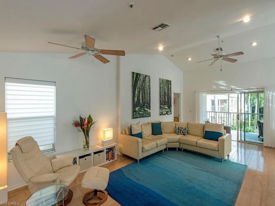 C.13217 - BEAUTIFUL MODERN TURN KEY CONDO IN PARK LIKE SETTING WITH A VIEW OF A POOL IN A DISTANCE. NEW WHITE KITCHEN, UPDATED BATHROOM, WOOD FLOOR IN MAIN LIVING AREA. ENJOY SUN FILLED LIFE IN THIS GREAT CONDO! PELICAN LANDINGS OFFERS OUTSTANDING AMENITIES.  See attached floor plan. NOTE  that this is only one of the two six unit buildings in Lakemont Cove and # 203 is 5ft wider. Upgraded TV /internet service coming 2018