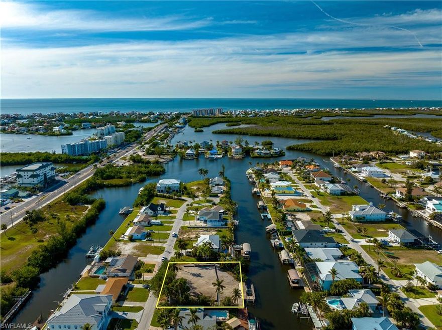 Seize this rare chance to own a vacant double lot in the heart of Bonita Springs, offering 150 feet of street and canal frontage on a sprawling 100-foot-wide canal. Located just moments from Barefoot Beach, this property delivers the perfect blend of privacy, luxury, and convenience. With an existing dock featuring dual boat lifts, your waterfront lifestyle is ready to set sail, bring your boats, kayaks, or paddleboards and enjoy direct access to serene canals and the Gulf of Mexico.
This property is a builder’s or investor’s dream, offering ample space to craft a custom estate or highly desirable spec home in a prime location. This lot already has central Water and Sewer hookups, as well as a two boat lifts and dock, saving you money. 
Surrounded by lush natural beauty and minutes from upscale shopping, dining, and entertainment at nearby Promenade At Bonita Bay, Coconut Point Mall and Mercato, it offers the best of Southwest Florida living. Relax on the pristine sands of Barefoot Beach or explore the nearby parks, preserves, and golf courses that make this area so sought-after.
Life here is all about effortless enjoyment, imagine mornings spent fishing from your dock, afternoons on the water, and evenings dining al fresco with sunset views. Don’t miss this unique opportunity to build the ultimate retreat or a lucrative investment property in one of Bonita Springs' most coveted neighborhoods. Act now, parcels like this are rare and in high demand!