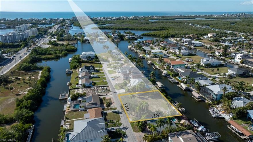 Seize this rare chance to own a vacant double lot in the heart of Bonita Springs, offering 150 feet of street and canal frontage on a sprawling 100-foot-wide canal. Located just moments from Barefoot Beach, this property delivers the perfect blend of privacy, luxury, and convenience. With an existing dock featuring dual boat lifts, your waterfront lifestyle is ready to set sail, bring your boats, kayaks, or paddleboards and enjoy direct access to serene canals and the Gulf of Mexico.
This property is a builder’s or investor’s dream, offering ample space to craft a custom estate or highly desirable spec home in a prime location. This lot already has central Water and Sewer hookups, as well as a two boat lifts and dock, saving you money. 
Surrounded by lush natural beauty and minutes from upscale shopping, dining, and entertainment at nearby Promenade At Bonita Bay, Coconut Point Mall and Mercato, it offers the best of Southwest Florida living. Relax on the pristine sands of Barefoot Beach or explore the nearby parks, preserves, and golf courses that make this area so sought-after.
Life here is all about effortless enjoyment, imagine mornings spent fishing from your dock, afternoons on the water, and evenings dining al fresco with sunset views. Don’t miss this unique opportunity to build the ultimate retreat or a lucrative investment property in one of Bonita Springs' most coveted neighborhoods. Act now, parcels like this are rare and in high demand!