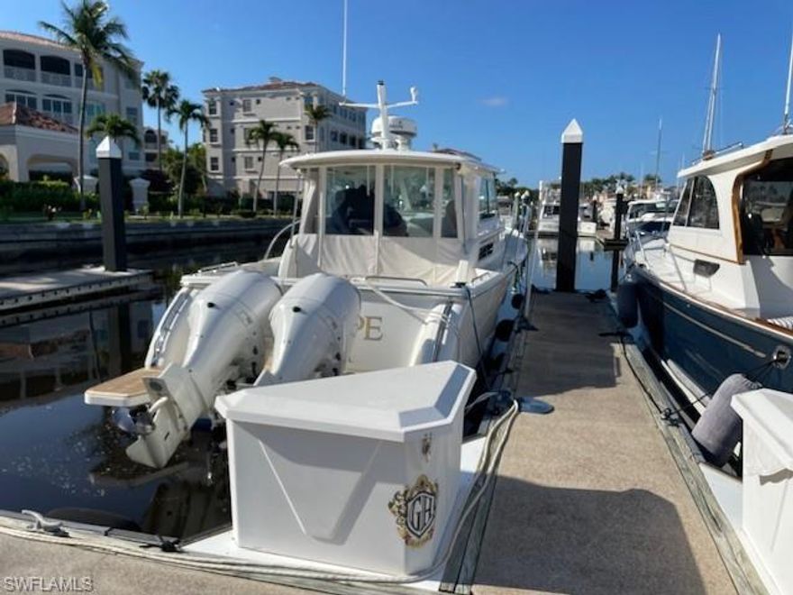 38' H-18 will accommodate a boat up to 40'10" with approved variance, maximum beam is 14'1", Condo Assoc fee $498 a month and includes use of the Marina Center, $150 appl fee once, non-residents pay $286 annually to the Master Association for community access. Concrete floating docks with electricity, water, pump out near each slip, a fuel dock with gas and diesel, laundry, showers and full time staff 7 days a week. Most of the stated beam width has been measured by marina staff but some of the beam width have not been measured so the developer numbers are stated. The Gulf Harbour Marina is actually on the Intracoastal Waterway about 5 miles to the Gulf Of Mexico.