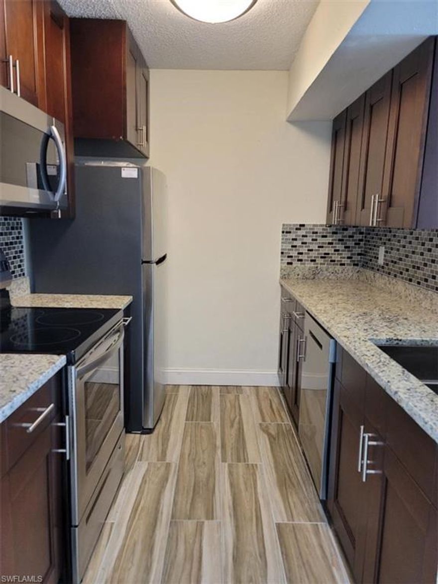 This modern first-floor end unit offers two bedrooms and two full bathrooms, featuring a recently remodeled kitchen with granite countertops and wood cabinetry. Water, sewer, and trash service are included in the rent, and the unit comes equipped with its own washer and dryer for added convenience. A small dog or cat under 20 lbs. may be permitted with owner and association approval. The community provides a welcoming atmosphere with amenities such as a clubhouse, pool, spa, tennis court, children’s play area, and picnic spaces. Located just a short drive from the beach, downtown Naples, and I-75, the property offers both comfort and accessibility. Move-in requires only the first month’s rent, a security deposit, and standard credit and association fees.