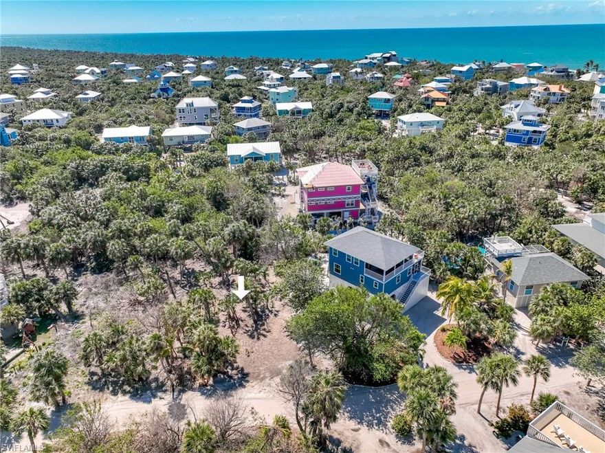 Mid-island building lot on North Captiva near the beach and ready for your custom vacation retreat! This property is partially cleared and preserved with the beauty of mature cabbage palms and native vegetation throughout.  All invasive Brazilian pepper trees have been removed. Imagine your dream home into existence in this lush, tropical setting.  Adjacent home on 4511 Schooner also available to purchase in a package deal.