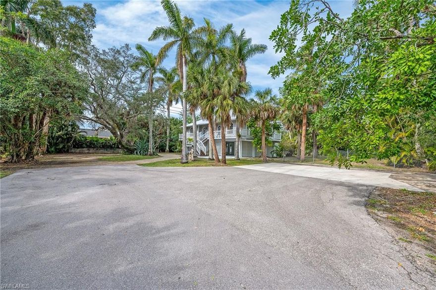 Investor's dream close to 5th Avenue South.  Two buildable lots with separate P.I.D. numbers.  Total lot size of .43 acres, approximately .22 acres per lot.  Not only is there a vacant lot, but also a lot with a move-in ready home to use and enjoy, and redevelop in the future.  Could be a family compound as it is at the end of the street on a cul de sac.  The vacant lot can easily accomodate a 3,000 sq ft home, and some research has already been done into that.  The three bedroom, two bath house on the adjacent lot, is elevated so that there is never a concern regarding flooding.  Spacious parking under the home allows for many vehicles to be parked.  This propery is an excellent investment as well as having a move-in ready home.  You could add your own touches to the home and perhaps a new landscaping design.  It has tremendous potential.  Cathedral ceiling in the great room of the home features a cupola that allows streams of natural light into that room.  Perfect for entertaining.  Spacious outdoor sunroom overlooks the pool and yard.  The house is wrapped in porches that allow for seating and enjoying views of your yard from multiple locations.  Tremendous privacy at the end of the street.  The property has much potential and is in a great location.  it won't last long.