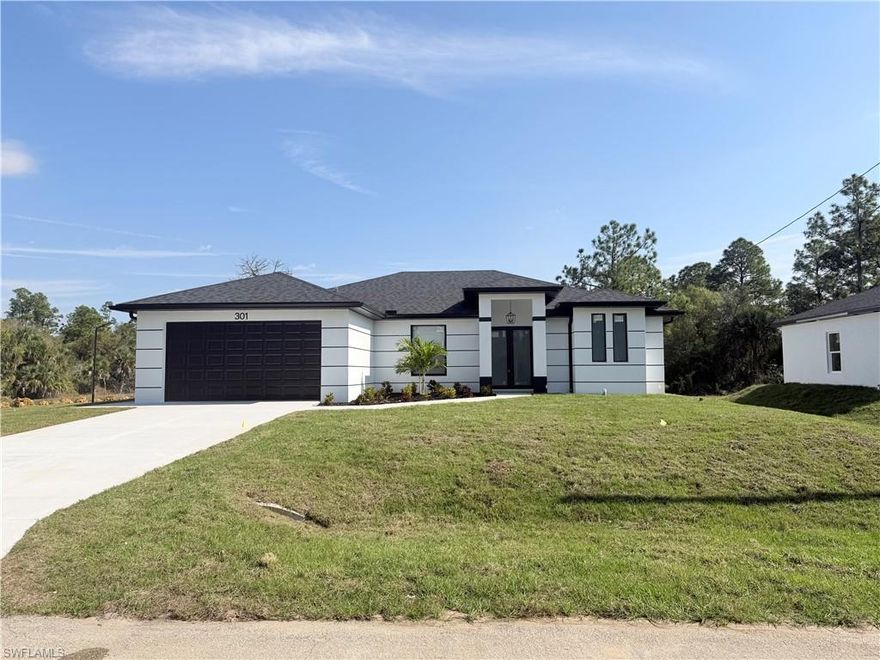 Stunning new construction home perfectly positioned on an oversized end-of-street lot with a canal along the side, offering privacy. This thoughtfully designed residence features 3 spacious bedrooms plus a versatile den and 2 beautifully appointed bathrooms. The open-concept layout showcases elegant upgrades and high-end finishes throughout, blending modern style with everyday comfort. Enjoy seamless indoor-outdoor living with a fully equipped outdoor kitchen—ideal for entertaining or relaxing in the Florida lifestyle. A rare combination of premium location, refined craftsmanship, and contemporary design, this home is truly a must-see.