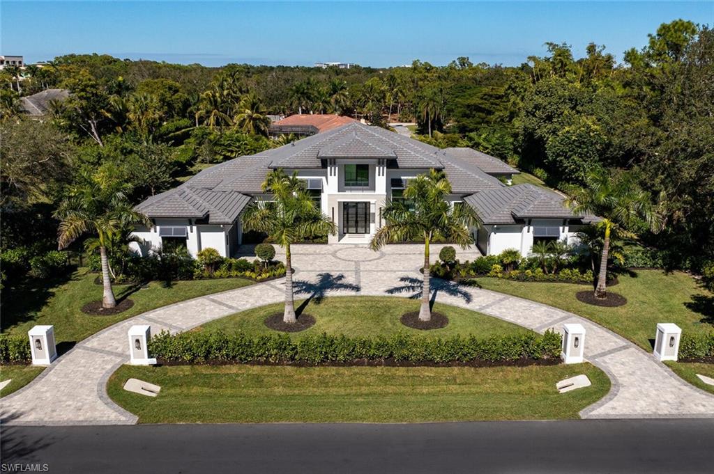 Photo of 137 Tupelo RD, NAPLES, FL 34108 (MLS # 225072251)