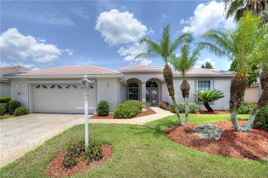 BEST BUY IN HERONS GLEN!!  Exceptional expanded OSPREY II home overlooking a lake, 2nd tee & fairway. This home offers 2 Bedrooms/2 Baths + DEN with storage closet.   All the features you could possibly want or need are part of this home. The upgrades include real bamboo flooring in the main living areas & den, tiled kitchen floor with a custom pattern beneath the kitchen table, tasteful wall mural in hall & laundry, custom mirrors in dining room , 12 ft. walk in closet in master, kitchen includes corian counters, 42 in. upgraded cabinets with light bar & crown molding plus lighted glass cabinet.  The garage is oversized with Skeet'r Beat'r garage screen & built-in cabinetry. The home features a water softening system, new A/C in 2016, electric & roll down shutters, stamped concrete drive and sidewalk, central stereo system and custom window treatments. You will love sitting on your lanai-which is all under roof-watching the golfers & enjoying the beautiful lake & sunsets. CALL TODAY to see this extraordinary home in Herons Glen-a gated golf and tennis community where the residents own the facilities with plenty of amenities for all and GOLF is optional!