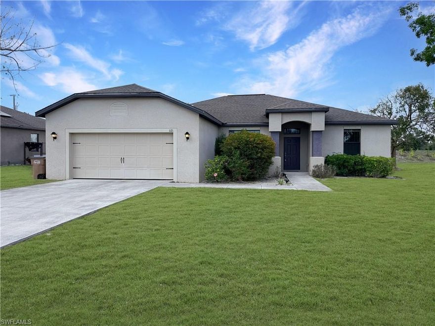 Not in a flood hazard area — most lenders will not require flood insurance! This spacious 4-bedroom, 2-bath home sits on a desirable corner lot with excellent parking and an open floor plan that creates a bright, welcoming space for living and entertaining. Features include low-balance water and sewer assessments, durable tile flooring throughout the main living areas, and plush carpet in the bedrooms. The oversized master bath is a standout, with a separate walk-in shower and relaxing soaker tub. Enjoy the comfort of a brand new A/C system installed in 2025.Conveniently located near shopping, restaurants, and schools. The lot features beautiful mature Barbados cherry and dwarf Meyer lemon trees and adjoins a short private access lane that provides plenty of off-street parking and added privacy.