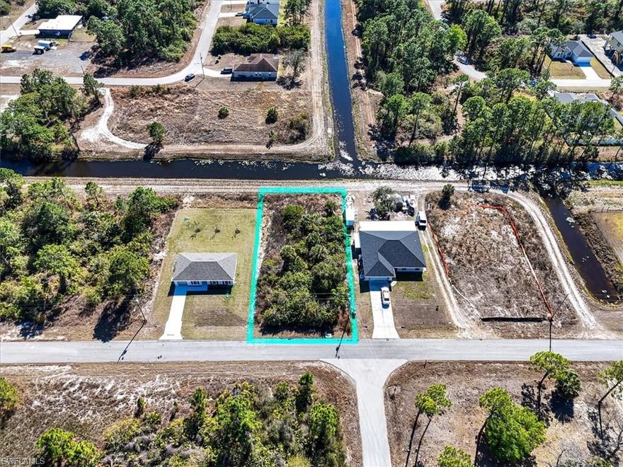 This 0.23 acre single-family residential lot is centrally located in Lehigh Acres, offering convenient access to local amenities and roadways. The property backs onto a canal, providing a pleasant outdoor backdrop and potential for scenic views or future landscaping. Positioned in Flood Zone X, the lot offers added peace of mind with minimal flood risk. Whether you’re planning to build or invest, this lot provides an excellent opportunity in a growing area of Lehigh Acres. Utilities are nearby, and the neighborhood supports single-family homes, making it ideal for future residential development. Don’t miss this chance to secure your piece of Lehigh Acres today.