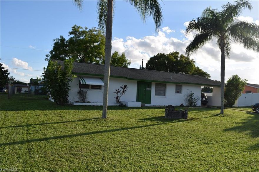 WOW! 2 bed 1 bath home, freshly painted inside with new flooring through out! Concrete block construction home on a beautiful lot in wonderful neighborhood within walking distance of shopping, restaurants, etc. Beautiful shading tree's in the fenced in back yard with lovely patio that is great grilling and entertaining. Charming Florida room will enable you to enjoy the breezes of SW,FL from any direction. Don´t miss this one, great buy in convenient area of Lehigh Acres with central water and sewer!