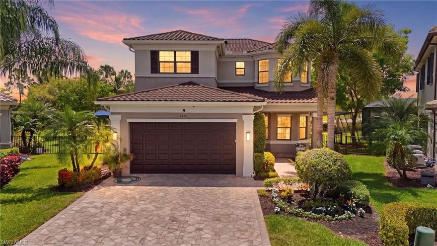 Welcome to 4220 Amelia Way, an exceptional upgraded residence in Stonecreek offering luxury indoor-outdoor living, premium finishes, and extensive custom enhancements throughout. This meticulously maintained home features a new stone-coated steel roofing system (2023), designed for durability and potential insurance savings, along with a whole-house Briggs & Stratton 23KW generator for peace of mind. The exterior impresses immediately with an expanded driveway and walkway, upgraded front landscaping, enhanced garage lighting, and a striking glass front door with smart lock entry. The oversized side yard has been professionally landscaped and fully fenced with front and rear gates, featuring custom walkways, a raised 16' x 18' patio, and tranquil access toward the lake. Designed for entertaining, the resort-style backyard showcases a saltwater pool and spa with four fountains, dual Pentair pumps and heater outdoor shower, and an expansive travertine lanai. The custom NatureKast outdoor kitchen includes a sink, beverage refrigeration, 48-inch Alfresco grill with rotisserie, sear station and smoker, plus a Thermador vent hood. Additional highlights include a gas fireplace, custom covered lanai ceiling, outdoor TV, Sonos speakers, privacy blinds, and panoramic picture-window screen enclosure. Inside, the gourmet kitchen is beautifully appointed with upgraded stacked cabinetry, glass upper doors, interior lighting, under-cabinet and above-cabinet lighting, custom backsplash, five-burner gas cooktop, French door oven, built-in microwave, wine cooler, pull-out pantry shelving, spice rack, and new refrigerator and dishwasher (2024). Throughout the home, you’ll find wood flooring, crown molding, upgraded lighting, granite windowsills, Sonos whole-home audio, central vacuum, intercom system, mold-control HVAC system, and thoughtfully customized living spaces. The living room features added windows for natural light and a custom entertainment center, while the stairwell and loft include custom wood detailing and upgraded railings. Bathrooms have been luxuriously upgraded with framed mirrors to the ceiling, frameless glass showers, upgraded tile and countertops, Moen fixtures, elongated toilets, and a soaking tub in the primary suite. Custom closets and built-in linen storage add both elegance and functionality. Residents of Stonecreek enjoy a premier resort-style lifestyle with exceptional community amenities including a grand clubhouse, resort pool and spa, lap pool, state-of-the-art fitness center, indoor sports court, tennis courts, pickleball courts, basketball courts, beach volleyball, playground, event lawn, social rooms, and an active calendar of community events and activities. Conveniently located in North Naples near shopping, dining, golf, and Gulf beaches, Stonecreek remains one of the area’s most sought-after gated communities
