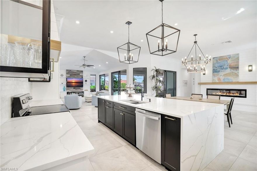 Boaters will love this upgraded 4-bedroom waterfront home with indirect Gulf access, a private dock, in a quiet cul-de-sac location. Thoughtfully updated for comfort and peace of mind, this spacious residence features an open, light-filled layout with vaulted ceilings and generous living areas that blend into the expansive screened lanai. With its cohesive, modern coastal aesthetic, it is perfect for relaxing or entertaining large gatherings. The custom kitchen is appointed with Quartz countertops, stainless-steel appliances, and generous cabinetry that flows seamlessly into the main living and dining spaces. The split-bedroom floor plan provides excellent privacy, and the primary suite offers lanai access. Structural upgrades add lasting value, including a new high-wind-rated roof (2025), hurricane-impact windows and doors, and a custom front door (2023). With four bedrooms and three full baths, there is abundant space for family and guests. The property features a seawall and dock, giving you the convenience of boating right from your backyard. There is also plenty of potential to customize your own outdoor oasis. Perfectly positioned near Marco Island’s gated Residents’ Beach, dining, and shopping, this home delivers the ideal blend of coastal living, modern updates, and boating lifestyle.