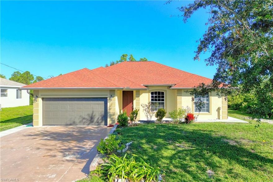 Lovely in Lehigh!  Don't miss the opportunity to see this fabulous 4 bedroom, 2 bath home conveniently located in southern Lehigh off SR-82.  Home features include updated bathrooms and kitchen, granite countertops throughout, stunning tile floors in all common living spaces, except bedrooms.  Bedrooms feature laminate wood flooring.  New interior and exterior paint. Roof replaced after Irma and A/C and water systems installed this year.  Enjoy outdoor spaces as well with a fully wrap around home sidewalk and sizeable patio pad across the entire back side of the house.  Great for entertaining!