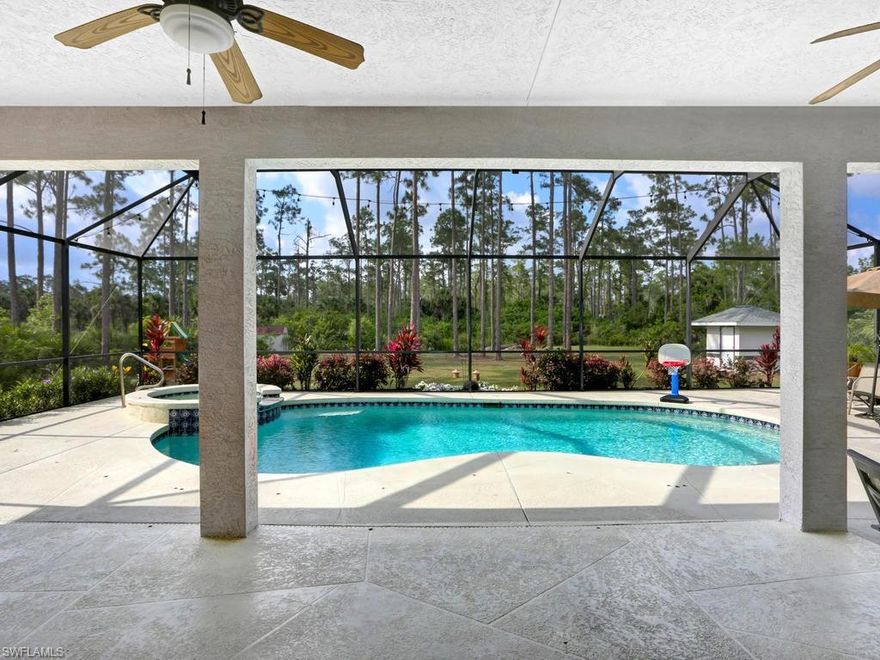 Stunning home featuring 4 bedrooms + Den with 3 full bathrooms placed on a private 2.7 acre lot in Golden Gate Estates. Enter your long asphalt driveway through a solar powered entry gate with key pad. This home has an over 1200 sq ft lanai recently re-screened, great for entertaining and enjoying your heated pool with spa! Special features include an oversized master bedroom with sitting area, a mother in law suite with separate exterior entrance, it's own bath, and a bonus room great for office space. Enjoy the use of the Premium KitchenAid appliances in your new large kitchen. The home has been beautifully maintained with recent updates including one AC unit and handler replaced in 2017 and the septic tank recently emptied. In 2018 the shingle roof was replaced, outside photo-cell lighting installed, and pool equipment replaced. The large lot has a concrete block pump house protecting your well equipment and a 10’ x 13’ metal lawn shed. Come see this beautiful home for yourself and it will not disappoint.