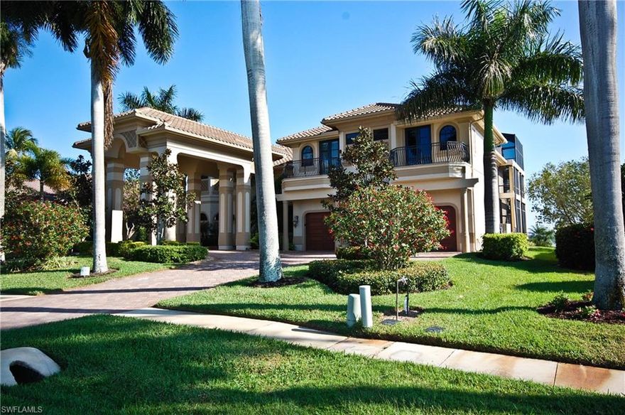 Magnificent custom estate w/ 5,000+ sq ft of luxurious living space on Marco River! Grand entrance w/ porte cochere, theater room, elevator, generator (for entire home) & new seawall. All bedrooms are suites (adjoining baths) & amazing water views from every room! 2nd floor guest suite has kitchenette. Beautiful infinity edge pool w/ never-ending water views, huge lanai & covered outdoor kitchen.