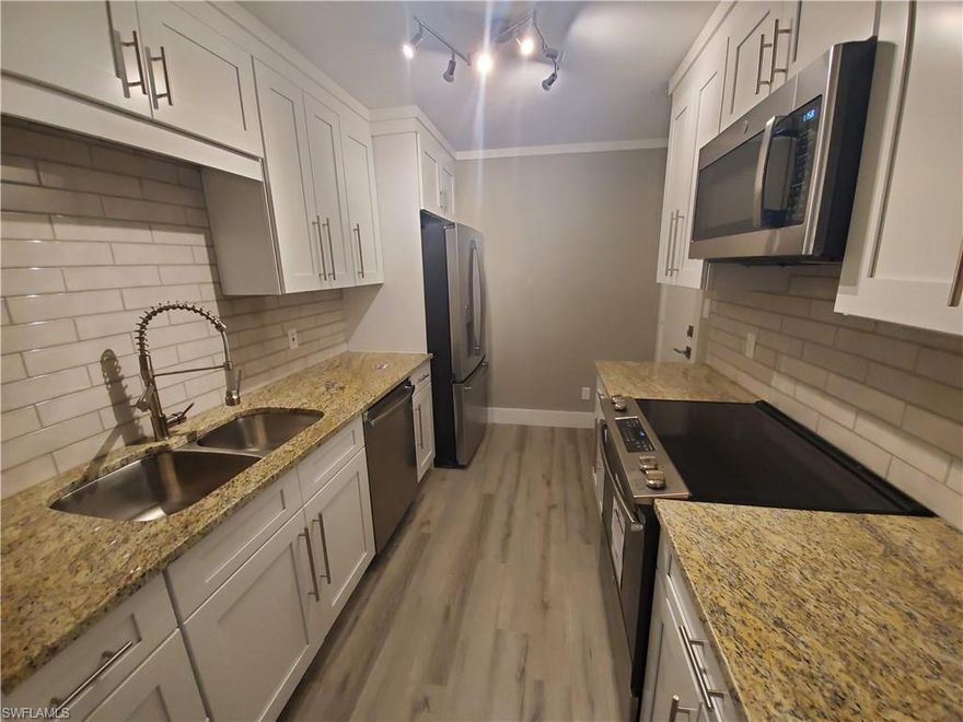 LIVE BRIGHTLY in this 5th Floor - TOP FLOOR Mid Rise Condo with breathtaking views of Lely and Hibiscus Golf Course (No Membership required) - ALL NEW JUST FOR YOU! Brand new heavy duty, waterproof, luxury vinyl plank floors - New Water Heater - New AC - New Digital Wifi AC Thermostat - New Interior Paint - New 3 inch Baseboards - New 2 Inch Crown Molding - New Kitchen with raised cabinets - New Fridge - New Glass Flat top stove - New Dishwasher - New Gourmet Refrigerator - New Kitchen Luxury Sink Faucet - New Granite counter tops in Bathrooms - New luxury bath shower/sink fixtures - Manual Hurricane shutters on the lanai - SPLIT Master Bedrooms each with own bath - HUGE Porch with sweeping views - Nothing to do, just move in! Luxury is yours.... You Deserve it!