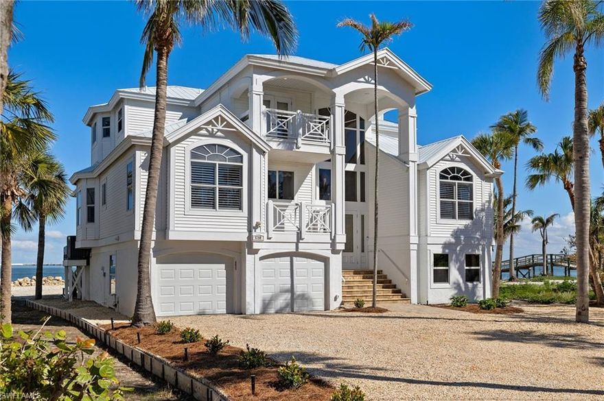 Bayfront Residence with Panoramic Views on Sanibel Island. Offered for the first time since its construction by the esteemed Wolter Group, this exceptional bayfront estate has been cherished by one family for more than 30 years. Perfectly positioned east of the causeway for effortless access on and off the island, the home is located just a block from the shops and dining of the east end village. Unparalleled bay views stretch across the horizon, enhanced by a natural beach shoreline. The expansive sunroom, designed for seamless indoor-outdoor living, features a wall of windows that wrap around the adjacent wall, creating a panoramic waterfront experience. The open-concept kitchen is thoughtfully designed with a prep island, wraparound bar seating, solid wood cabinetry, granite countertops, a wine refrigerator, double ovens and a stainless-steel French door refrigerator. A work burning fireplace anchors the main living space, adding warmth and charm. A three-story elevator provides easy access to all levels, while the ground floor offers abundant parking and storage, including a tandem-depth double garage with a bayside garage door for effortless kayak and watercraft launching. The bayfront pool, complete with a swim-up table, invites relaxation while taking in the sweeping waterfront vistas. This meticulously maintained home presents a rare opportunity to own a legacy property in one of Sanibel’s most sought-after locations.