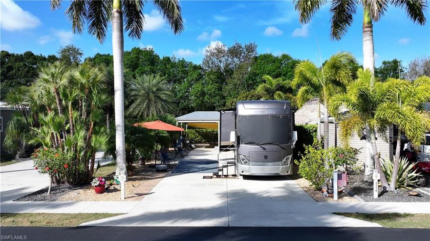 Welcome to Site 10 in highly desirable Cypress Trail RV Resort in Fort Myers. Priced at $169,999, this 35’ x 90’ (3,150 sq ft) RV lot offers the perfect blend of privacy, functionality, and tropical charm.
The concrete pad is in excellent condition and is complemented by additional pavers surrounding the property, creating expanded outdoor living and entertaining space. A lush variety of mature tropical foliage frames the lot, providing a private, resort-style setting.
The fully finished accessory building is thoughtfully designed with relaxed beach-inspired finishes and includes a washer and dryer, refrigerator, shower, and toilet—offering exceptional convenience for seasonal or extended stays. An extended roof line provides additional shaded outdoor space, while a massive shade cover at the rear of the property enhances comfort and usability year-round.
Quarterly HOA dues are $975.
This well-appointed property is ideal for those seeking a move-in ready RV lot in one of Fort Myers’ premier RV resorts.