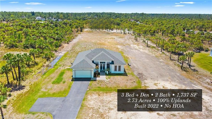 Located in Golden Gate Estates, this well-maintained 3-bedroom plus den, 2-bath home sits on 2.73 acres of 100% upland property, offering privacy, flexibility, and true Florida living with no HOA restrictions.
Built in 2022, the home features a functional split-bedroom floor plan with tile flooring throughout and a bright, open living area designed for both everyday comfort and entertaining. The kitchen is equipped with quartz countertops, stainless steel appliances, a center island, and ample cabinetry, flowing seamlessly into the main living and dining spaces.
The primary suite offers walk-in closets and a spacious bathroom with dual sinks and a walk-in shower. Additional features include impact-resistant windows and doors, recessed lighting, and a large covered lanai perfect for outdoor living.
The property is fully usable and cleared, with an asphalt driveway, irrigation system, and plenty of room to expand. Whether you envision adding a guest house, workshop, pool, or additional structures, the possibilities are wide open.
Conveniently located with easy access to Everglades Blvd and Golden Gate Blvd, and just a short drive to shopping, dining, and everyday amenities.
This is a rare opportunity to own a newer construction home on fully upland acreage in one of Naples’ fastest-growing areas.