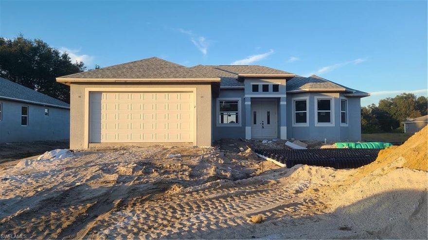An updated model of one of the most popular 2021 new construction homes in Lehigh Acres. Estimated completion by the end of Feb. 2021. Step into the double entry door, a large open living area welcomes you with modern light interior color gives you airy and roomy feel. Huge dining room space can fit a large dining table to meet your big family/large event needs. Property boasts 9-foot ceiling throughout the house with double tray ceilings in the living room to bring it up to 11 foot. Large open style kitchen includes high level granite counter tops, soft close wood cabinets, stainless steel appliances, kitchen island and pantry. This home features a well designed split floor plan. 8-foot interior doors, 20-inch beautifully patterned large polished tiles throughout the house. Tray ceiling in the master bedroom. Master bathrooms features his and her sinks, separate garden tub, walk-in shower with polished river stone floor. 6 more same model new construction homes available in zip code 33976.