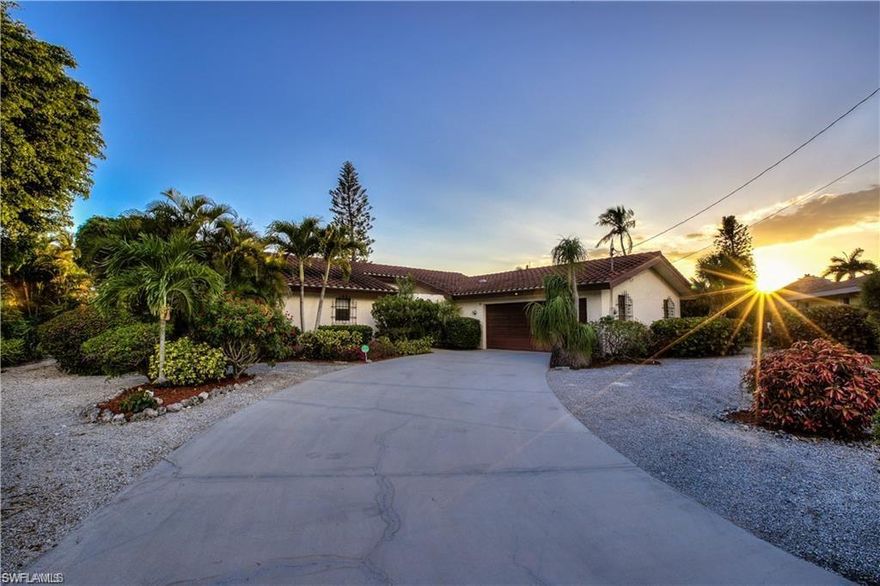 Truly a beautiful, warm, and charming canal front home nestled in the magic of tropical Sanibel Island on the desirable east end of the Island. Rare to market, ground level home(high ceilings)in Shell Harbor with a gorgeous custom pool with stone coping and waterfall. Minutes by boat to the Gulf of Mexico with a dock with canal frontage for two boat lifts. The amazing canal frontage on intersecting canals means every room has incredible water views. The living room with wood beamed cathedral ceilings, opens onto the spacious patio overlooking the heated pool and canal. Spacious updated kitchen with granite and new appliances includes an eat in area which can comfortably seat 8 people. This unique home also includes a TESLA charging station, 2 full baths AND 2 half baths, 2 outdoor lanais, one to enjoy your morning coffee and a second to enjoy the beautiful sunsets overlooking the heated pool and canal. Short walk/bike ride to beach and Shell Harbor residents-deeded beach access including private parking. When you walk in you can tell the family has taken such loving care of the home.