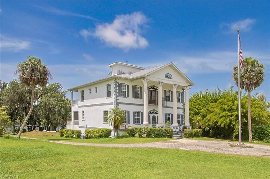 Timeless Riverfront Grandeur on the Caloosahatchee.  Experience the pinnacle of Southern elegance in this stately Greek Revival masterpiece, perfectly positioned on over an acre of prime riverfront in historic Alva. Framed by soaring columns and majestic oaks, this estate offers a rare blend of architectural significance and serene waterfront living.

The Residence, from the grand foyer’s soaring ceilings to the light-filled formal spaces, every inch of this home is designed for grace. The heart of the home is a seamless indoor-outdoor sanctuary; wide sliding glass doors in the living room and kitchen retract completely, opening to a sprawling screened porch that captures constant river breezes. Whether hosting a gala or enjoying a quiet morning coffee, the backdrop of the Caloosahatchee is ever-present. Truly elevated living with an elevator servicing all levels, ensuring long-term accessibility.  A sanctuary featuring a cozy fireplace, spa-like en suite, and dual walk-in closets. Beyond the 3 bedrooms and den, the ground level offers a massive garage/flex space ready to be transformed into a professional studio, private gym, or collector’s gallery.  Dual laundry rooms (one per floor) and a kitchen designed for large-scale entertaining.  Located on the charming, tree-lined Historical Pearl Street in "downtown" Alva, this property captures "Old Florida" at its finest. Down the street from the Alva Boat Ramp, Alva Museum and the Alva Post Office.  Spend your evenings on the sweeping back balcony watching spectacular sunsets over your private estate, all while being just a short drive from the modern conveniences of Fort Myers.