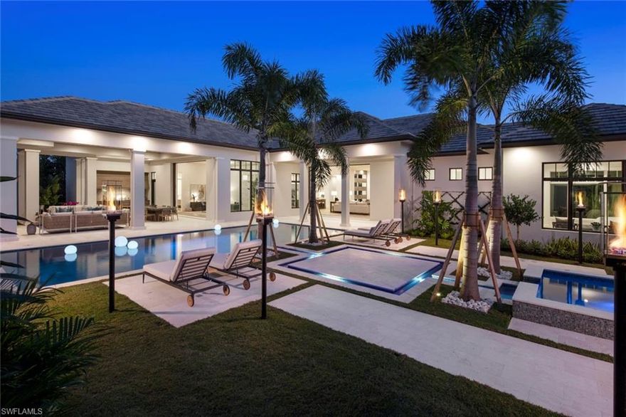 Tropical Resort Living Reimagined! This stunning 2019 Rustic Contemporary Estate in the heart of Pelican Bay lives like your own private resort. Starting with its extraordinary curb appeal, the architecturally inspired stone and wood exterior is perfectly complemented by lush mature tropical landscaping. A contemporary yet casual coastal interior vibe flows throughout. You will appreciate multiple feature walls, floor-to-ceiling windows, gorgeous custom cabinetry, chic designer furnishings... AND THAT POOL!! Two spacious outdoor living areas overlook a 50 resort-style pool, 8 infinity spa, and gaslight tiki torches that light at the touch of a button all nestled in a completely private backyard. With over 4,600 sf under air, four en-suite bedrooms and a den, three living areas, a Chef's kitchen with top-of-the-line appliances, and much more. By award-winning team Stofft Cooney/Knauf-Koenig Group/Calusa Bay. The attention to detail in this beautifully constructed home will exceed every expectation. Situated on a 1/2 acre lot with a spacious backyard. Pelican Bay offers 3 miles of private beach access with 2 beachfront clubs; an active tennis program; 27 holes of challenging golf.