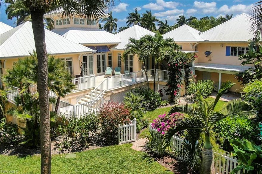 A beautiful Old Florida style home situated on an oversized lot (133 x 150) one block to the Gulf of Mexico, and a short distance to Fifth Ave South. Featuring a southern exposure, this five-bedroom, plus a study residence has been well maintained, and offers a great room plan with vaulted ceilings and an abundance of natural light-filled spaces. Designed by Jerry DeGennaro, the home features an open kitchen with large center island, wine cooler, stone quartzite countertops, and gas cooktop. In addition to the cooking spaces, the home offers multiple gathering spaces both indoors and outdoors. The bedrooms offer privacy with well-suited closet spaces and spacious bathrooms. Additional highlights include Andersen impact windows and doors, home entertainment system, Kohler generator, phantom screens, pre-wire for a future lift to the fifth bedroom suite, lush tropical landscaping, private spa, and parking with alley access.