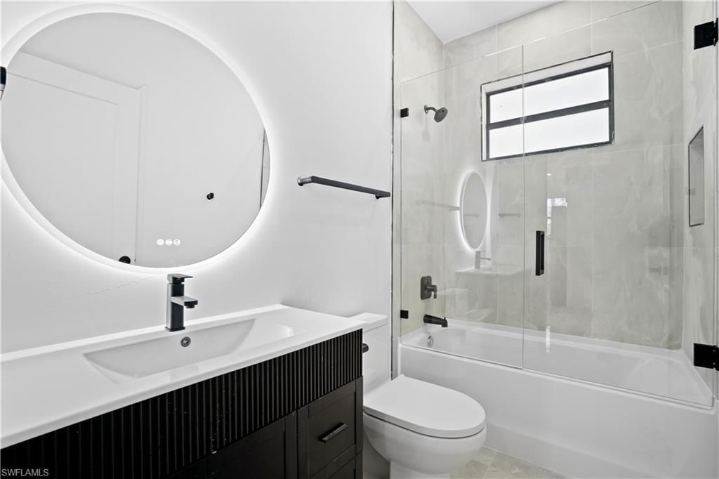 Photo of 322 Loire AVE S, LEHIGH ACRES, FL 33974 (MLS # 226013908)