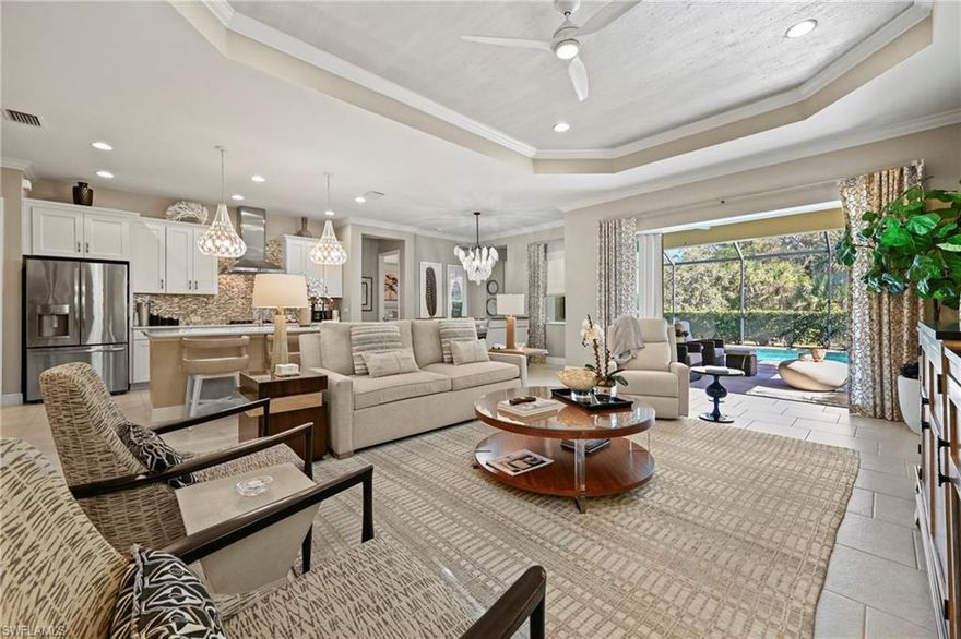 From the moment you step inside, this home wraps you in warmth and quiet elegance. Every space has been thoughtfully curated, lovingly maintained, and beautifully enhanced with designer finishes that elevate everyday living. Tray ceilings add architectural interest, statement lighting brings personality, and the expansive kitchen island naturally becomes the heart of the home—perfect for gatherings, conversations, and connection.

Professionally decorated by the owner herself, the home feels both refined and welcoming, striking that rare balance where luxury still feels livable. Upgrades are everywhere you look, yet nothing feels overdone. The layout is truly ideal—3 bedrooms plus a den and 3.5 baths—offering the perfect amount of space for family, visiting guests, or a flexible work-from-home lifestyle. The third bedroom currently serves as a design studio, showcasing just how versatile this floor plan can be.

Storage is abundant and thoughtfully planned, with generous bedroom and hall closets, a pantry with roll-out shelving, and garage storage that keeps everything effortlessly organized. The oversized primary suite is a true retreat, while the pool bath adds convenience for indoor-outdoor living.

Step out to the lanai and unwind in complete privacy, surrounded by peaceful preserve views and plenty of room to lounge or entertain. Impact windows throughout, natural gas, a 22kW Generac generator, and a transferable Home Tech warranty provide everyday comfort and confidence. Add in low HOA fees and a neighborhood designed for easy living, and you have a home that simply feels right.

Perfectly sized, impeccably cared for, and filled with heart—this is a home meant to be lived in and loved.