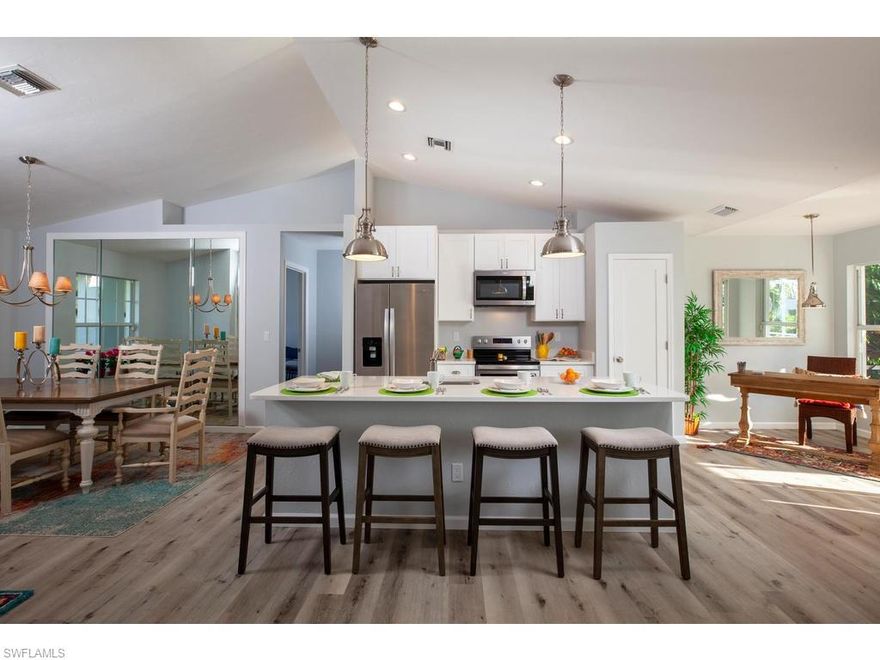 Completely renovated FCI 3 bedroom / 2 bath / 2 car garage pool home right next to Mackle Park.  Enjoy all of the amenities of Mackle Park, the Marco Island Library, the Marco Museum ( plus Rose Hall ).  Short distance to Tommy Barfield, the Middle School, the Marco Charter Academy, the Marco Island Racquet Club, and YMCA.  A total renovation to include: new roof, engineered hardwood flooring throughout, open kitchen Island with an extra deep stainless-steel sink; all new kitchen cabinets and quartz counter tops.  All new stainless steel Whirlpool appliances; side by side fridge-freezer, stove, microwave, dishwasher, washer and dryer.  All new doors to the bedrooms, bathrooms, closets, kitchen and linen pantries, laundry, as well as, the front and side garage doors.  Both the main and guest baths have all new glass enclosures.  The landscaping and lawn have been restored with new plantings and flower bed plants.  Freshly painted inside, outside, pool terrace and garage.  All doors and windows have hurricane shutters which are stored in garage loft.