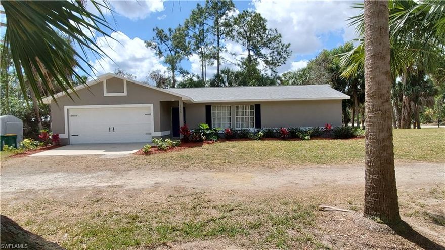 Reduced Again.  Beautiful home, recently renovated on 2.34 Acres.  Just Listed, won't last.  CBS home with 3 bedrooms, 2 bathrooms and a 2 car attached garage.  Great location off of Randall Blvd near the Publix Shopping center.  This home has been recently updated with new "wood look" vinyl plank flooring throughout the home, new stainless steel appliances, new bathroom vanities and toilets, new ceiling fans and lighting, new paint inside and out, and new A/C unit with all new duct work.  The home has vaulted ceilings.  Seller will consider providing closing cost help with full price offer.   This is the one of the best deal in Golden Gate Estates on 2 plus acres.  Dont miss out.