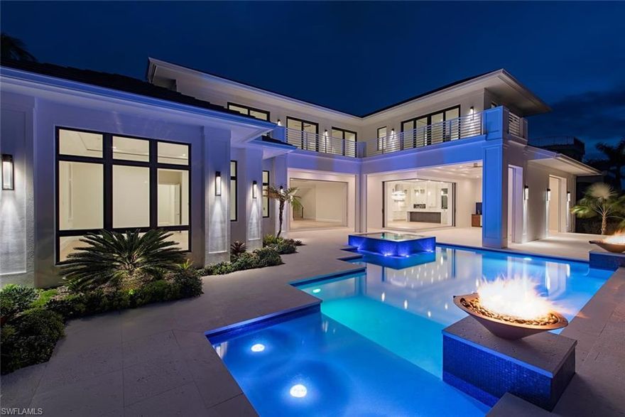 Classic Bermudian architecture infused with contemporary elegance and old Florida charm.  Penned by Falcon Design Consultants, brought to life by BBA Development, Inc., and finely appointed and furnished by Natasha Pereira Interior Design this home offers the finest in building materials and technologies to offer lasting value and peace of mind. Solid concrete construction, energy efficient materials, natural stones and woods provide not only durability, but also longevity.  Large rooms with an abundance of glass and detail, generous outdoor living spaces, both covered and uncovered, create a seamless transition from indoor to outdoor living.  Retractable screens and shutters, large pool and spa, great lift-ready 80 foot dock, and a true 4 bay garage with the ability to add lifts for the serious car enthusiast are a some of the highlights of this special offering.