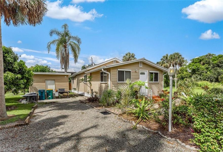 This Cozy Captivating Home could be yours! COMPLETELY GUTTED AND REBUILT in 1996 from newly poured footers. Updated Kitchen with Island and LOTS OF STORAGE!  Newer AC only 3 years old, Walk-In Jetted Shower only 2 years old. Situated on 2 Lots completely landscaped with plenty of room for an addition, pool, boat storage or even another structure!  Enjoy the ABUNDANCE of Fruit Tree’s surrounding the home that include Mango, lychee, Macadamia, Cherimoya, Meyer Lemon, 2 Avacado, Longan, & Peanut Butter Fruit. EVEN MORE STORAGE in Extra Shed next to home.  Very Quiet Neighborhood Just Minutes from Shopping, Restaurants and Lovely Downtown Naples 5th Avenue. Walking distance to Naples Botanical Garden or Sugden Park! Only 2 short Miles from Bayview Park and Boatramp that provides ACCESS TO GULF OF MEXICO!!  Make SURE you come and see this Rare Find here in South Naples and make it YOUR Cozy Sanctuary!!
