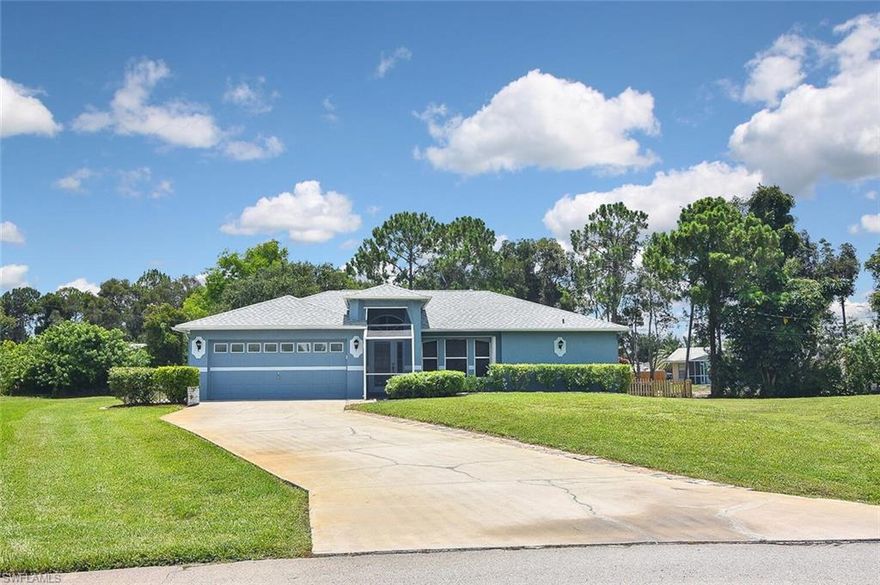 Looking for space? Paradise found!  This spectacular pool home offers three bedrooms, 2 bathrooms, a large two-car garage, and a huge 1/2 acre lot with a canal in the rear of the property.  RV and boats welcome! NO HOA rules or fees. This home is immaculate, and pride of ownership radiates throughout.  A new roof was installed in 2020, the water system is less than two years old, and the owner's suite has a new/ upgraded shower.  With an open great room and volume ceilings, this home shows very light and bright. Located in a PRIME SW Florida location close to FGCU, I-75, schools, shopping, dining, and of course world-renowned beaches minutes away.