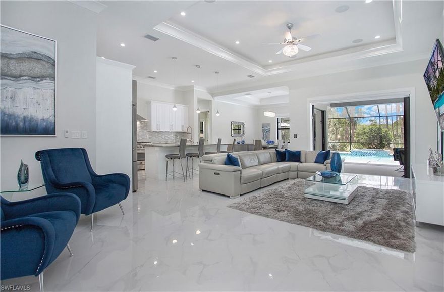 Why Wait for New! This beautiful home is situated on almost 3 Acres all 100% uplands and it’s close in, just built-in 2021. As you walk in the front doors you are greeted with a spacious foyer and office, continuing your way to the great room and kitchen with views of the pool and outdoors. The kitchen features white cabinetry, tile splash with quartz tops, stainless steel appliances, a gas stove, and a huge walk-in pantry. The owner's suite features a tray ceiling & sliding doors to the pool alongside the owner's bathroom with a free-standing garden tub, walk-in shower, spacious vanities with quartz, linen closet, private water closet with bidet, and custom walk-in closets. This home checks off all the boxes that the most discerning buyer is looking for; porcelain tile throughout, tray ceilings, upgraded lighting, fixtures, window treatments, impact glass, surround sound, security system, 2 A/C's, 2 water heaters and more. The two guest rooms have plenty of privacy and each have walk-in closets and bathrooms.  When you are ready to relax or entertain step outside to your screened patio and enjoy the brand new salt water pool & spa complete with sun ledge and water feature.