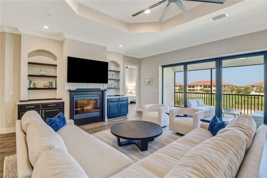 FULL GOLF MEMBERSHIP INCLUDED! Step inside to this fabulous 2nd floor Bellisimo VII coach home built in 2019 with an attached one car garage, exceptional modern design & views overlooking the golf course and lake. The den & main living areas of the home boast high tray ceilings, crown molding, wood flooring, modern fixtures, electric fireplace, hurricane impact windows, and desired open living, making this a great place to entertain family and friends. The eat-in kitchen is white & bright complimented with a custom backsplash and features a large center quartz island & countertops for dining and prep-work, 42” white cabinetry, GE stainless steel appliances, and pantry. The private, western-facing master bedroom possesses an oversized walk-in closet, his and her sinks, ceramic tile and spacious clear glassed chrome shower. The main living flows seamlessly onto the screened lanai for all to enjoy those sunset views over the golf course and lake. Esplanade Golf & CC is ideally located in North Naples with amenity rich lifestyle & resort style amenities including: golf course, resort pool, cabanas, walking trails, 6 tennis courts, dog park, fitness center, salon, tiki bar & more!