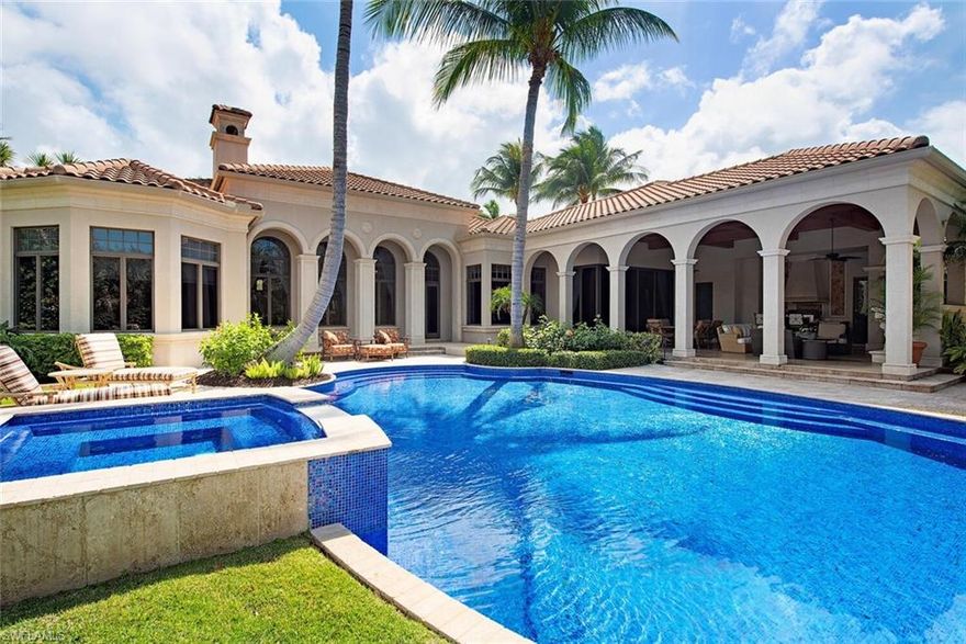 Welcome to Resort Style Living, Welcome to Grey Oaks. Don't miss this immaculate, 4 bedroom + den, 5 (1) bathroom residence in sought after Estuary at Grey Oaks Country. This beautiful home provides privacy, peacefulness and endless sunsets with its south westerern exposure. This magnificent residence sits perfectly on the spacious lot showcasing an expansive outdoor living area with an exquisite pool and spa and tranquil water and golf course views. With 5,731sq. feet of living space under air there is plenty of room for family and friends to gather. The open floor plan offers seamless flow in addition to an abundance of natural light. Breathtaking wood accents can be found in the home including gorgeous flooring, wet bar, chef’s kitchen and home office. Grey Oaks Country Club is Naples one and only private club with 54 holes of golf. In addition, the club offers exclusive amenities for all, from the newly renovated wellness center to the lagoon style pool, tennis, pickle ball, bocce, restaurants, spa... the amenities are endless.