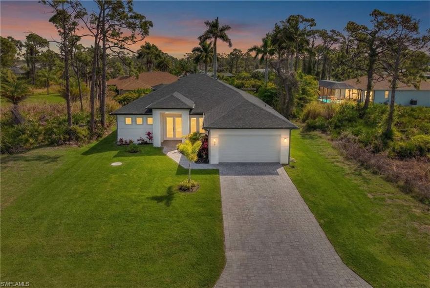 Stunning 2025-built modern home in Rotonda West — 133 West Dr. Offering 1,872 SF under air (2,612 SF total), this bright open-plan residence features 3 bedrooms, 3 full baths and a 2-car garage. Thoughtfully designed with sweeping sightlines from the great room to a chef’s kitchen with large waterfall island, white cabinetry, premium countertops and ample storage. Wide-plank wood-look flooring, high ceilings, recessed lighting and energy-efficient systems throughout. Private primary suite with spa bath and generous closet; two additional ensuite bedrooms plus a flexible bonus/office space. Covered paver patio overlooks a landscaped yard, ideal for Florida indoor/outdoor living. Move-in ready!