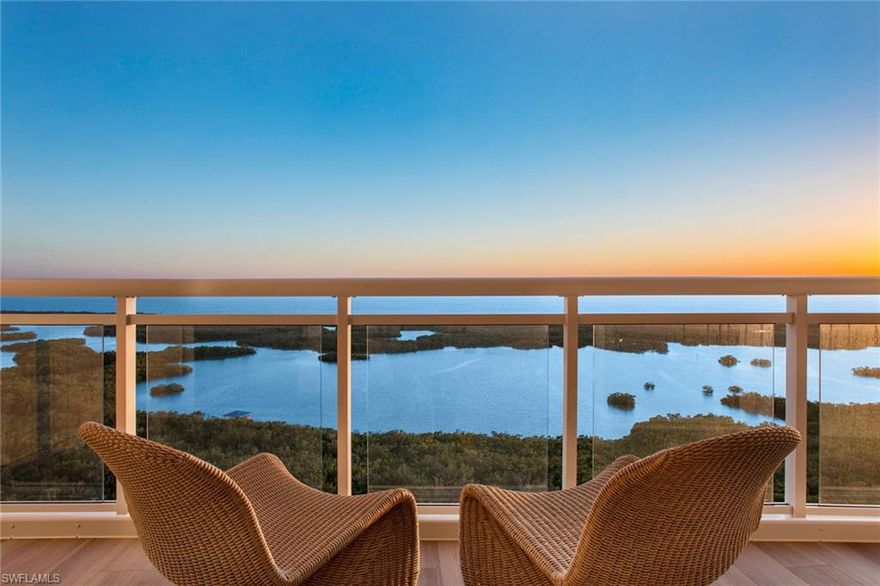 Imagine waking up to breathtaking views of the Naples coastline from your new luxury condominium in the premiere resort destination of Kalea Bay! This exquisite one-year-old unit on the 22nd floor of Tower 400 offers an unparalleled coastal living experience, designed to cater to discerning tastes. The floor plan features four bedrooms, and four and a half baths meticulously planned by renowned design firm, Soco Interiors, and the property is being offered turnkey furnished. The open concept living area with stunning custom gas fireplace seamlessly blends into outdoor living. The wrap-around lanai has glass railings and faces southwest. At the 22nd level, your vantage point includes sunsets, boats in the bay, wildlife in the mangrove preserve, shell seekers on the white sandy beaches and sparkling lights from the high-rises in North Naples. The kitchen is equipped with Wolf and Sub-Zero appliances, a natural gas range, quartz countertops, custom cabinetry, an oversized island, a wine cooler and a butler’s pantry with a prep sink. The primary suite is a sanctuary of comfort, complete with spacious walk-in closet and en-suite bath featuring dual quartz vanities, a walk-in shower and a soaking tub. All bedrooms are en-suite, and the primary suite, kitchen and main living areas face out to the water. This home has high ceilings, hardwood floors throughout all main rooms and bedrooms, and designer light fixtures. The impact-resistant windows and ceiling-to-floor window walls provide ample natural light. The home also has solid-wood interior doors, accordion hurricane shutters on the lanai to protect the outdoor furniture, a private elevator foyer that leads directly into the residence. Tower 400 amenities include a 7,500-square-foot rooftop terrace, an open-air fitness center, a sky lounge and grilling area, and a negative-edge pool. Kalea Bay is a guard gated community with patrolling security. Each building has a secure lobby with an on-site property manager, and this unit has two assigned parking spaces, conveniently next to the lobby entrance. The Club at Kalea Bay offers an array of world-class amenities – along with beach club memberships. The centerpiece of the Club is the 100,000-square-foot amenity center, featuring three pools, expansive decks and a state-of-the-art wellness center. The clubhouse includes the Driftwood Cafe and Salt and Oak Restaurant, two open-air bars and a variety of recreational facilities such as a resort pool, adults-only pool, kids’ wading pool, teen lounge and kids’ game room. Tennis and pickleball enthusiasts will appreciate the dedicated courts and programs available. The Bay Cottages provide overnight and extended accommodation, reserved exclusively for members and their guests. This luxury condominium is more than just a home, it's a lifestyle. Embrace the elegance and sophistication of coastal living at its finest.