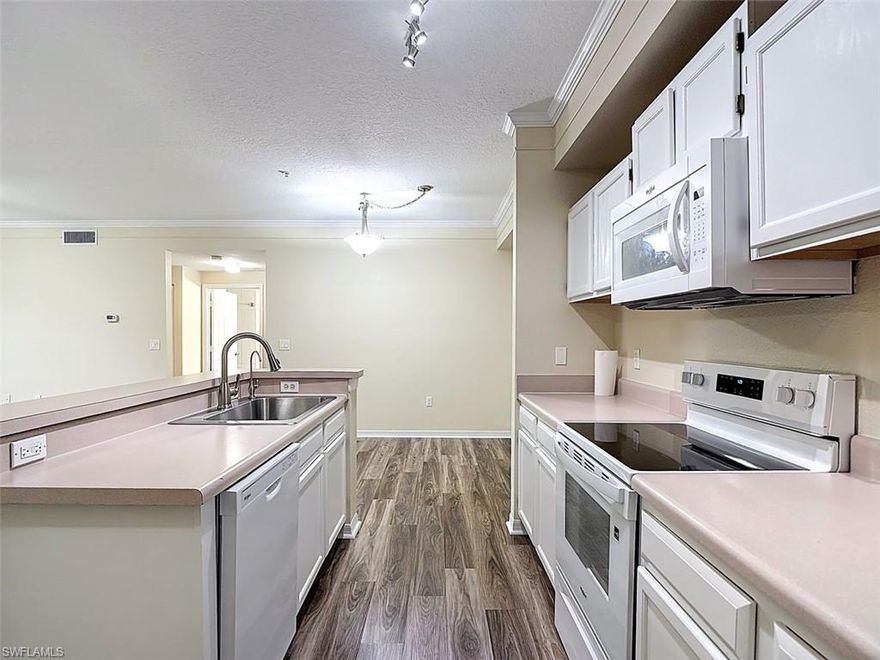 Welcome to this charming 2-bedroom, 2-bath condo located in the desirable Royal Greens at Gateway Condominium in Fort Myers. The community features meticulously landscaped grounds with a peaceful, pristine setting.

This freshly painted, move-in ready unit welcomes you with a bright and airy living space and an open-concept floor plan. The spacious bedrooms provide comfort and privacy, while the separate dining and living areas offer flexibility for everyday living and entertaining. AC installed 2024. New Refrigerator, Microwave and AC in 2024. Water heater 2025. Dishwasher, Range, Washer & Dryer 2026.

The well-appointed kitchen is perfect for hosting family and friends or simply enjoying a quiet evening at home. Relax and unwind in your spacious enclosed lanai, ideal for taking in the serene surroundings.

Enjoy resort-style amenities including a pool within walking distance, as well as a fitness center and clubhouse. Conveniently located with easy access to RSW Airport, beautiful beaches, shopping, dining, and more.

Take the virtual tour and schedule your private showing today!