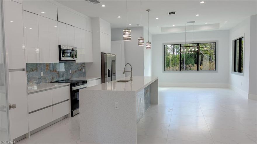 Brand-new construction in Golden Gate Estates on 2.73 acres! This spacious home offers 4 bedrooms plus a den and 3 full bathrooms, designed with comfort and functionality in mind. The primary suite features a luxurious bathroom with a walk-in shower, soaking tub, and double sink vanity. Enjoy open living spaces filled with natural light, impact-resistant windows and doors, and quality finishes throughout. Step outside to your outdoor kitchen—perfect for entertaining—surrounded by plenty of space for a pool, guest house, or future expansion. Sprinkler system included. A rare opportunity to own a new construction home with privacy, space, and modern features in a desirable location.