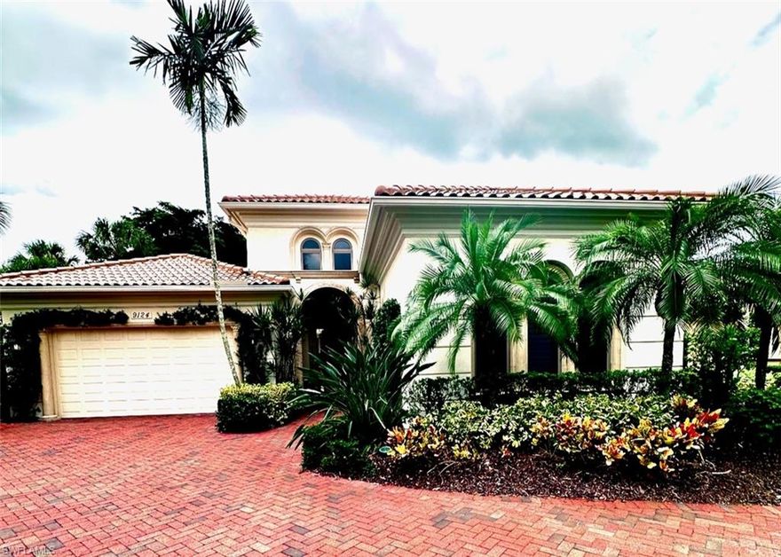 Step into this captivating lakefront residence through a gracefully arched entrance and instantly transport yourself to a tropical paradise. Nestled at the cul-de-sac's end within the prestigious Terrabella enclave in Pelican Marsh, this property has been meticulously designed to prioritize the privacy and comfort of both homeowners and guests. This remarkable home boasts an expansive courtyard entertainment area encircling the pool, spa, and outdoor kitchen, all adorned with fragrant jasmine and vibrant bougainvillea. Numerous features combine to create an inviting yet refined atmosphere, with the main house showcasing impressive 14-foot ceilings and a striking glass wall that affords breathtaking views of the shimmering lake. A separate enhanced cabana offers premium accommodations with a bedroom, a cozy living area, a convenient morning kitchen, and a full bathroom, providing an ideal retreat for visiting guests. Pelican Marsh is a private, gated community that offers a wealth of amenities, including a renowned tennis and pickleball program, a well-equipped fitness facility, bocce ball courts, and a new restaurant.